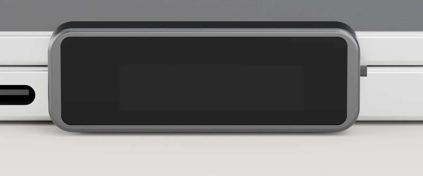 Render: the Possum key face on, along the side of a MacBook. Its screen shows the possum and the state picked below.